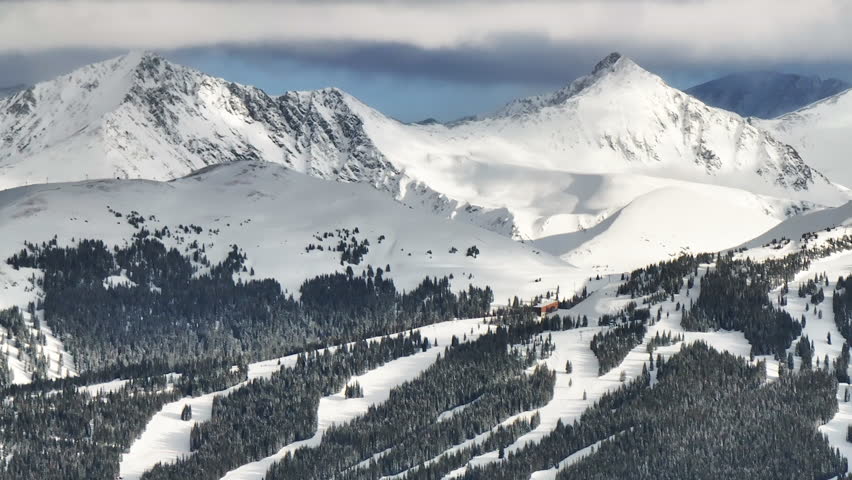 Vail pass i70 perspective of Copper Mountain ski resort American Fyler lift trail runs ten mile range Leadville Colorado ikon Rocky snowy winter spring snowy peaks evening clouds sunset upward motion