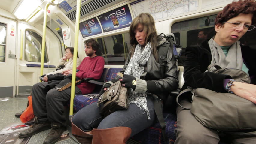 LONDON - OCTOBER 8: Unidentified passengers sit in train carriage on October 8,