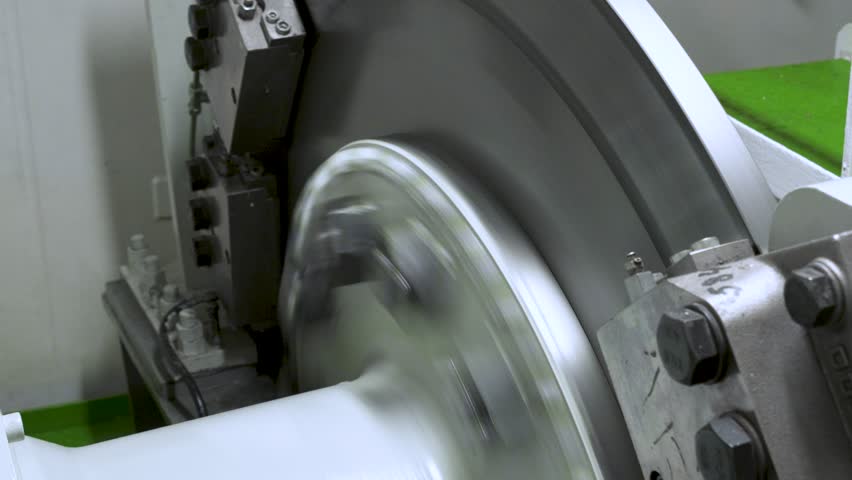 Disc brake on vessel shaft. Big disc with brake on shaft from diesel engine to propeller. Main shaft rotates in motor room of boat.