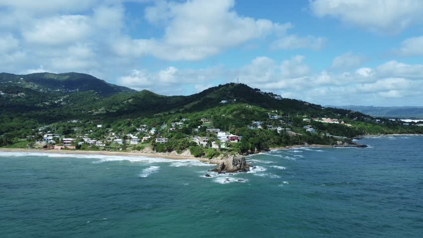 Advancing Aerial Drone Push Shot over Caribbean Beach with Crashing Waves from Playa El Negro in Ceiba, Puerto Rico. 