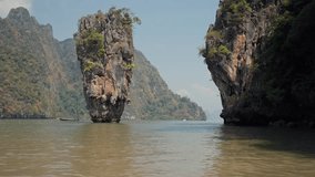 Beautiful view of Khao Phing Kan Island. James Bond Island, famous karst rock grows out the calm green Andaman sea in National Park In Phuket, Thailand. Travel, vacation, sea nature, tourism concept.