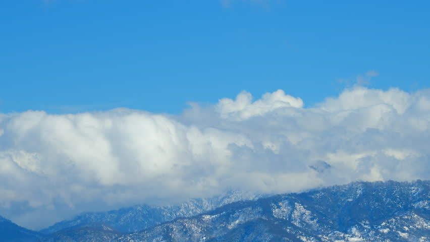 Mountain Landscape. Stunning Mountain Landscape. Peak Range And Pine Woods And Forest In Snow. Timelapse.