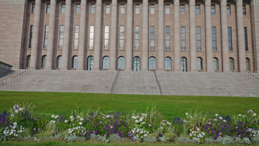 The Parliament House of Finland, Classical architecture of Helsinki. Summer, Morning, Sunny day, No people. Tilt movement camera.