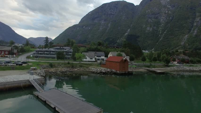 Norwegian town with surrounding mountains and fjord