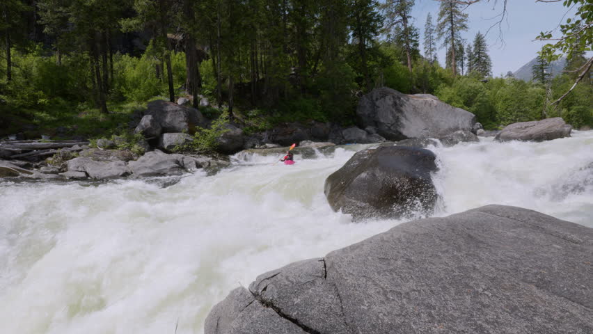 Extreme Whitewater Kayaking Over Class 5 Rapids