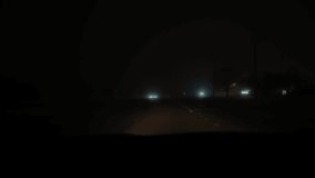 POV Point of view, car driving on city way on extremely foggy environment. Wide shot - Powered by Shutterstock - Get 15% off with code: PIKWIZARD15