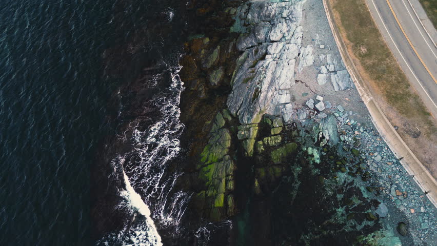 Sunrise light glows along Ocean Avenue waterfront coastline in Newport Rhode Island