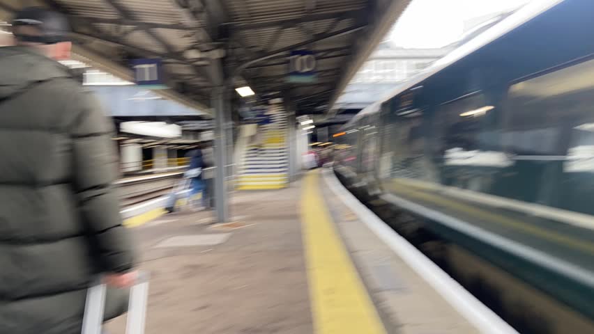Paddington, London, UK - 02.02.2024: Time-lapse of Paddington train station, customers walking along train platform to exit- video footage  Royalty-Free Stock Footage #3473555755
