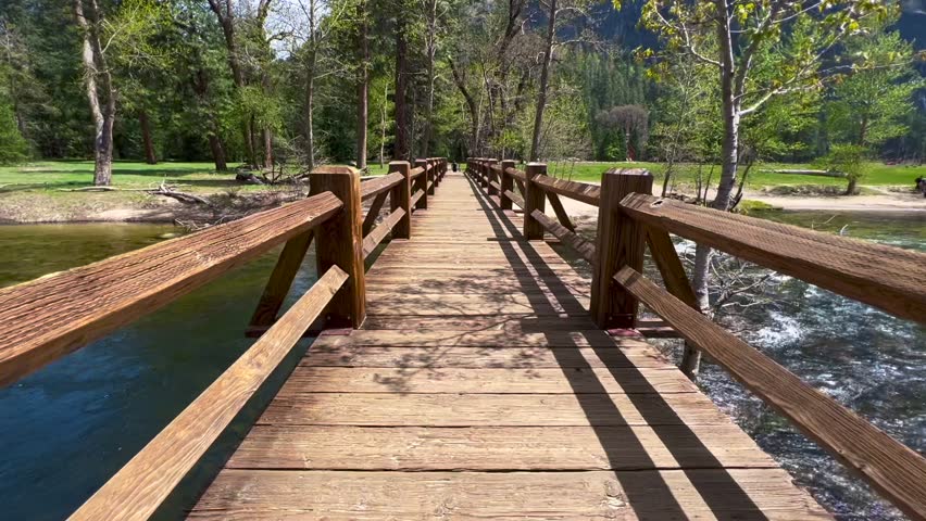 Walking Across A Wooden Bridge Over A River Beautiful Nature Hike Yosemite National Forest California National Park Mountains