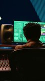 Vertical Video African american sound engineer feeling happy with his recorded song on mixing console, working in music industry post production. Audio technician making a hit song in control room