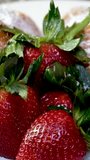 closeup of croissant sprinkled with powdered sugar with strawberries and mint leaves delicious dessert french breakfast restaurant serving cook at home decorate many different videos with strawberries