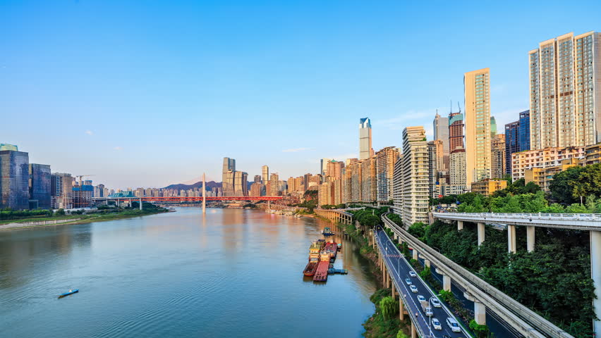 Chongqing skyline and modern city buildings scenery by the river. Famous travel destinations in China. 4k time lapse video.
