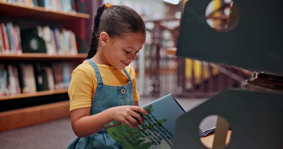Reading book, story or girl in a library for a fantasy in school campus for education on bookshelf. Smile, learning or smart child student with scholarship studying knowledge, research or information