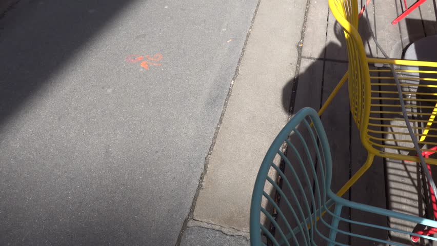 Vienna, Austria Colorful  tables and chairs at an outdoor restaurant.