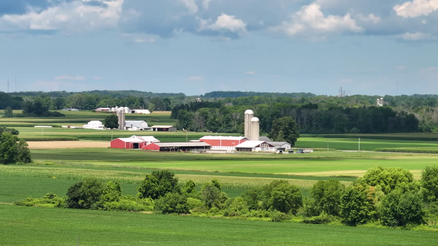 American rural farm with silos in Midwestern USA. Agricultural landscape in United States