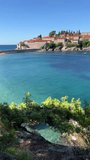 Montenegro Adriatic sea view on the Sveti Stefan island, vertical video.