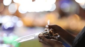 Street Food Asia: Women choose food at a night market. High quality 4K slow motion foodie concept video. Chiang Mai, Thailand.