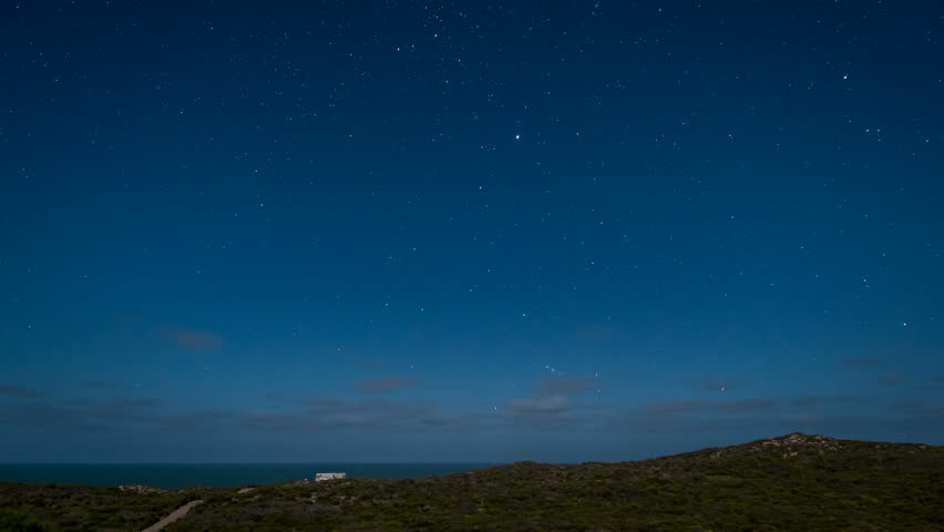 Time lapse of stars in motion over the coast under moonlight in Western Australia.