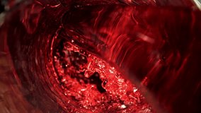 Red wine is poured into a glass. Top view. Filmed on a high-speed camera at 1000 fps. High quality FullHD footage - Powered by Shutterstock - Get 15% off with code: PIKWIZARD15