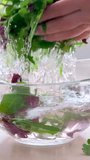 Super Slow Motion Shot of Flying Cuts of Colorful Vegetables and Water Drops on Black background High quality FullHD footage