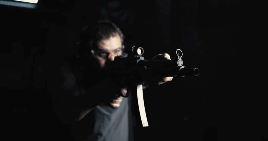 High-Speed Shooting with HK SP5K Assault Rifle, Person Aiming and Firing