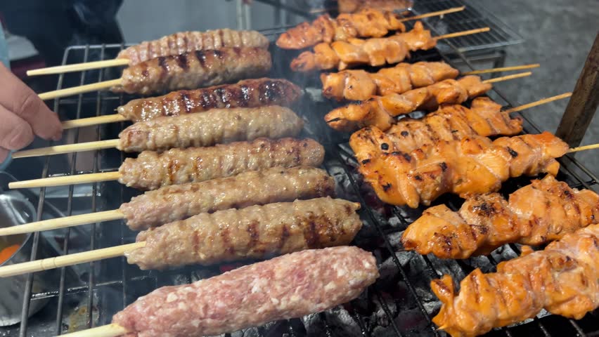 Turkish Cuisine Charcoal Grill Lamb Charred Meat. Culinary Traditional Smoky Barbeque Adana Kebab. Roasted Halal Shish Meat. Cook Roasts Shish Kebab Barbecue On Grill. Arabic. Food Grilled  Royalty-Free Stock Footage #3473967265