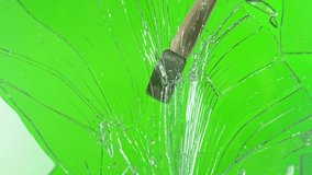 Super slow motion of glass-breaking hammer, shattering against green screen background . Filmed on high speed cinema camera, 1000 fps . - Powered by Shutterstock - Get 15% off with code: PIKWIZARD15