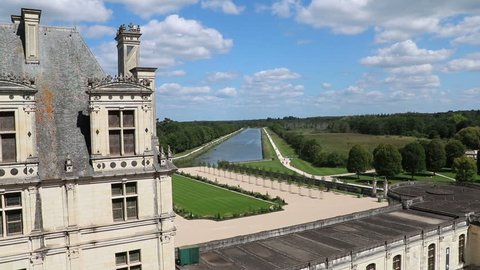Château Chambord, Looking Over Water With Cloudy Blue Sky In The Loire Valley, France
	