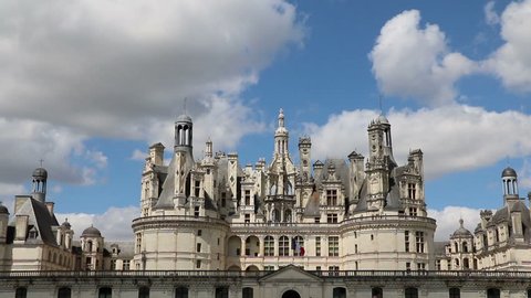 Château Chambord, Loire Valley, Cloudy Blue Sky, French Flag Flying.