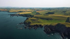 Aerial View of Britain's Coast: Scotland’s Cliffs and Small Fishing Village of St Abbs. Scottish Landscape.