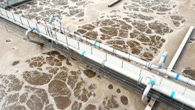 Sewage treatment plant from above. Grey water recycling. Waste management theme. Ecology and environment in European Union. - Powered by Shutterstock - Get 15% off with code: PIKWIZARD15