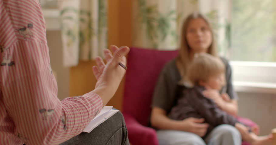 Child's challenges with autism spectrum disorder ASD addressed during consultation child. Specialist provides detailed insight into child's unique needs and potential interventions. Early intervention Royalty-Free Stock Footage #3474237603
