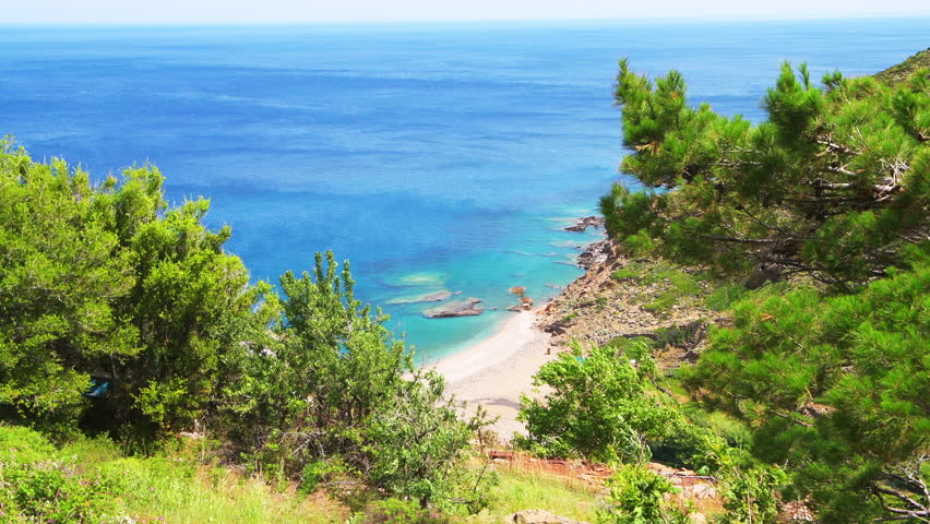 Aris beach by Karavostamo village on Ikaria island, Greece with landscape nature view of longevity blue zone