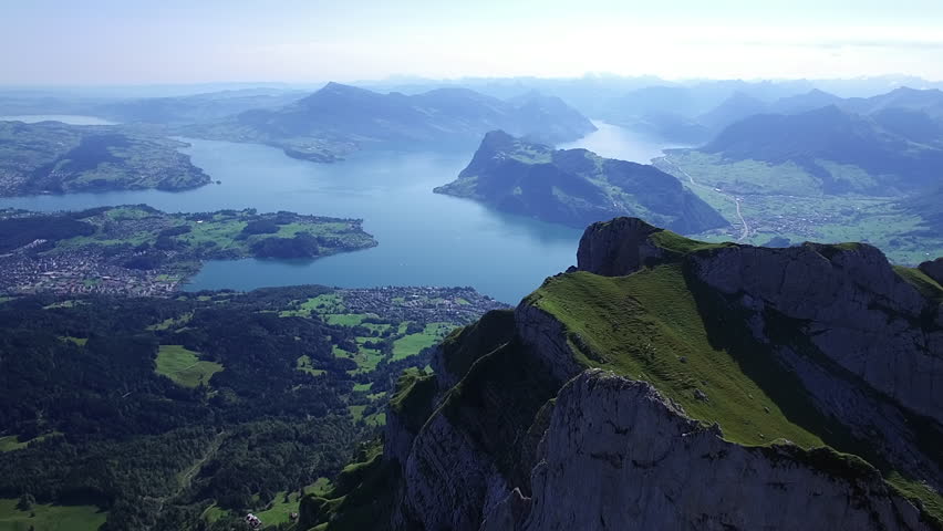 a view of a lake from the top of a mountain