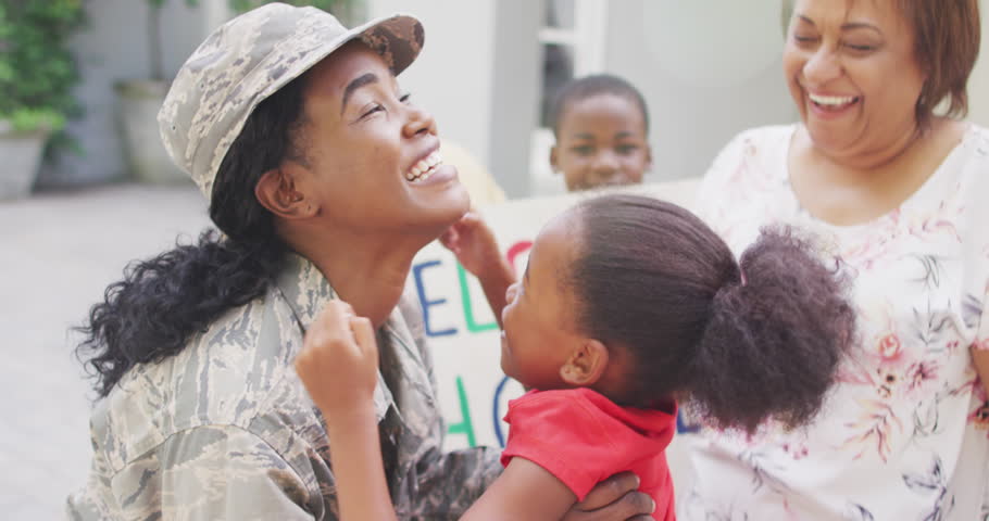 Animation of happy african american soldier mother and daughter hugging and embracing. family, togetherness, army and american patriotism concept. Royalty-Free Stock Footage #3474430781