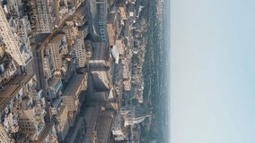 Vertical video. Rome, Italy. View of the Vatican. Basilica di San Pietro, Piazza San Pietro. Flight over the city. Evening time, Aerial View, Point of interest