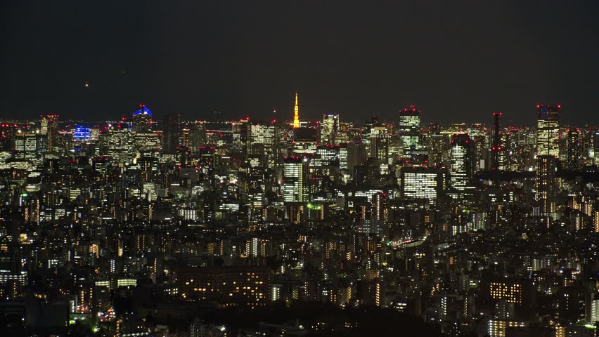 TOKYO, JAPAN : Aerial high angle CITYSCAPE of TOKYO at night. View of buildings around Shinjuku and Minato ward. Japanese city life, business and urban metropolis concept shot.