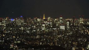 TOKYO, JAPAN : Aerial high angle CITYSCAPE of TOKYO at night. View of buildings around Shinjuku and Minato ward. Japanese city life, business and urban metropolis concept shot. - Powered by Shutterstock - Get 15% off with code: PIKWIZARD15