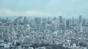 TOKYO, JAPAN : Aerial high angle view of CITYSCAPE of TOKYO in daytime. View of central downtown area. Japanese city life and nature concept video. 4K real time shot.