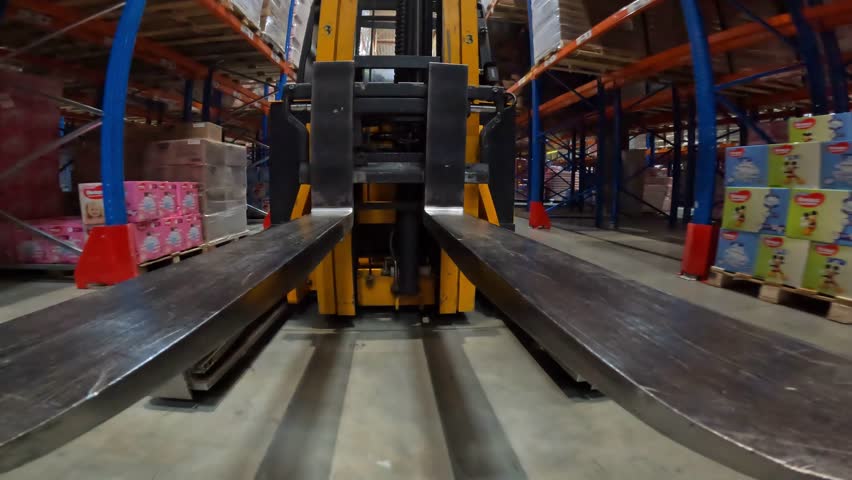 Forklift in the warehouse concept. work in a modern warehouse concept. Forklift in a modern warehouse. Visualization of modern technologies in the warehouse of the factory. Royalty-Free Stock Footage #3474573053