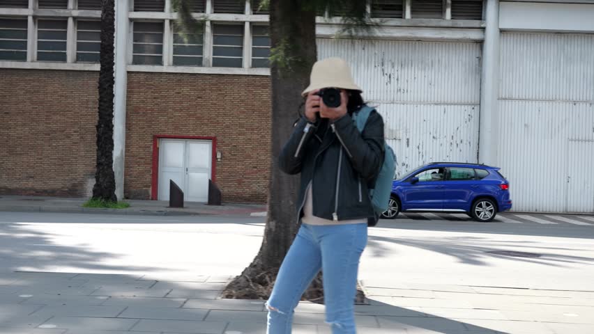 Tourist photographing the city of Barcelona.