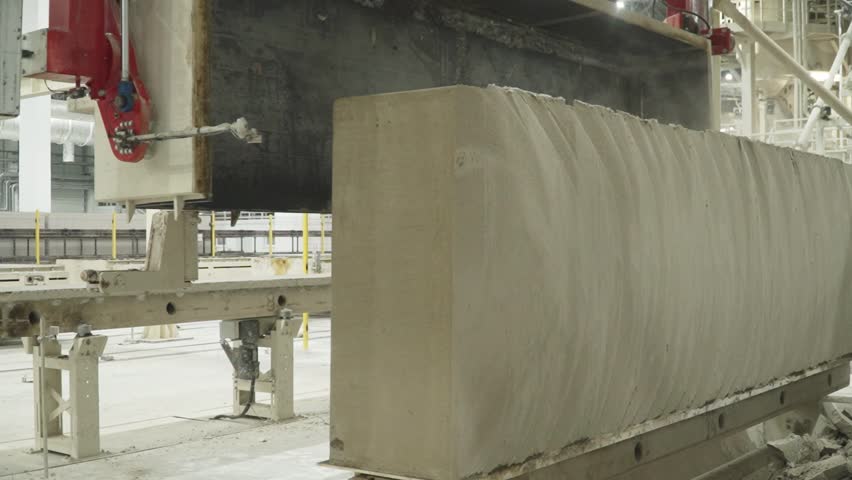 Removal of the iron bath and hardened mixture for the production of aerated concrete blocks and release of the mold for subsequent processing Royalty-Free Stock Footage #3474707133