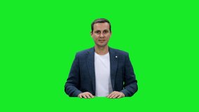 Young adult blogger sitting and talking on green background, Chroma key, 4k pre-keyed footage - Powered by Shutterstock - Get 15% off with code: PIKWIZARD15