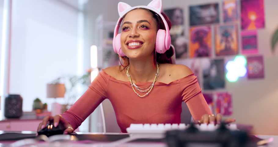 Esports, gaming and woman at computer in home with headphones for online video game. Happy, gamer and girl relax in house streaming on pc or playing in virtual competition with challenge in contest