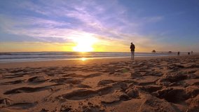 the stunning beauty of Albufeira Beach at sunset in mesmerizing 4K resolution with this captivating time-lapse video. Watch as the sun dips below the horizon