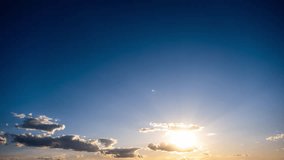 Timelapse of cumulus clouds moving in the blue sky against the sun. Cloud space background with many light and grey clouds changing shape, time lapse. Change of weather. Nature, sky clouds, copy space - Powered by Shutterstock - Get 15% off with code: PIKWIZARD15