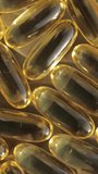 Cod liver oils supplement organic omega-3 close-up. Vertical video.