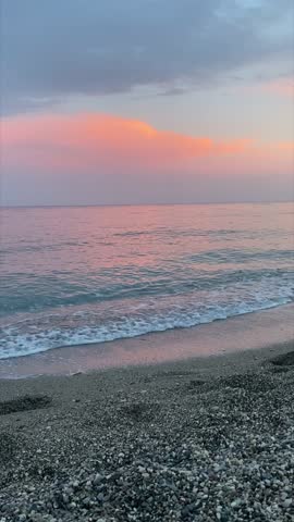 pink sunset on the beach of the Mediterranean sea