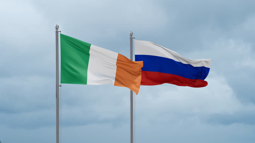 Russian Federation and Ireland flag waving together on cloudy sky, endless seamless loop Royalty-Free Stock Footage #3474951289