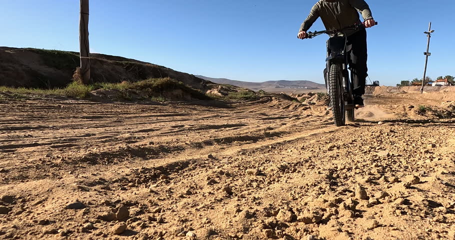 Bike, dirt and wheels with sports person on off road course for competition, performance or race. Motorcycle, speed and training with athlete rider on vehicle for adventure, adrenaline or power